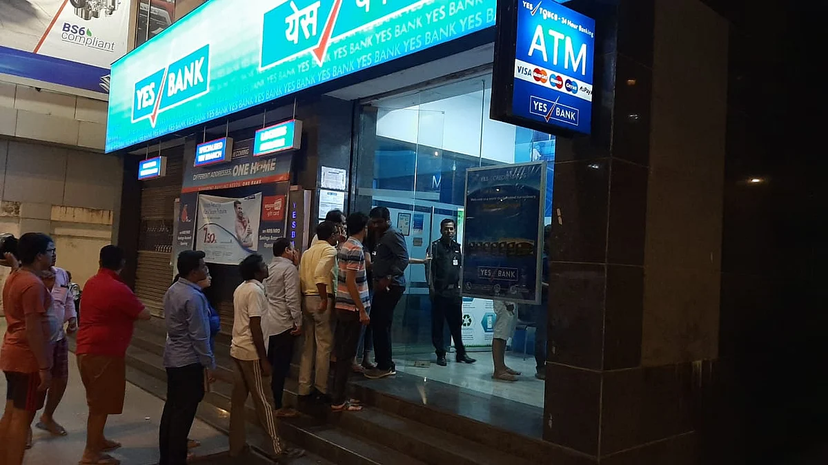 Depositors wait outside a Yes Bank branch in Worli, Mumbai hours after the government placed it under a moratorium. (Photographer: Advait Palepu/ BloombergQuint)