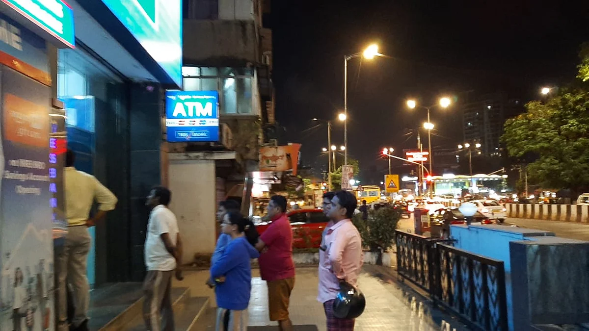 Depositors wait outside a Yes Bank branch in Worli, Mumbai hours after the government placed it under a moratorium. (Photographer: Advait Palepu/ BloombergQuint)