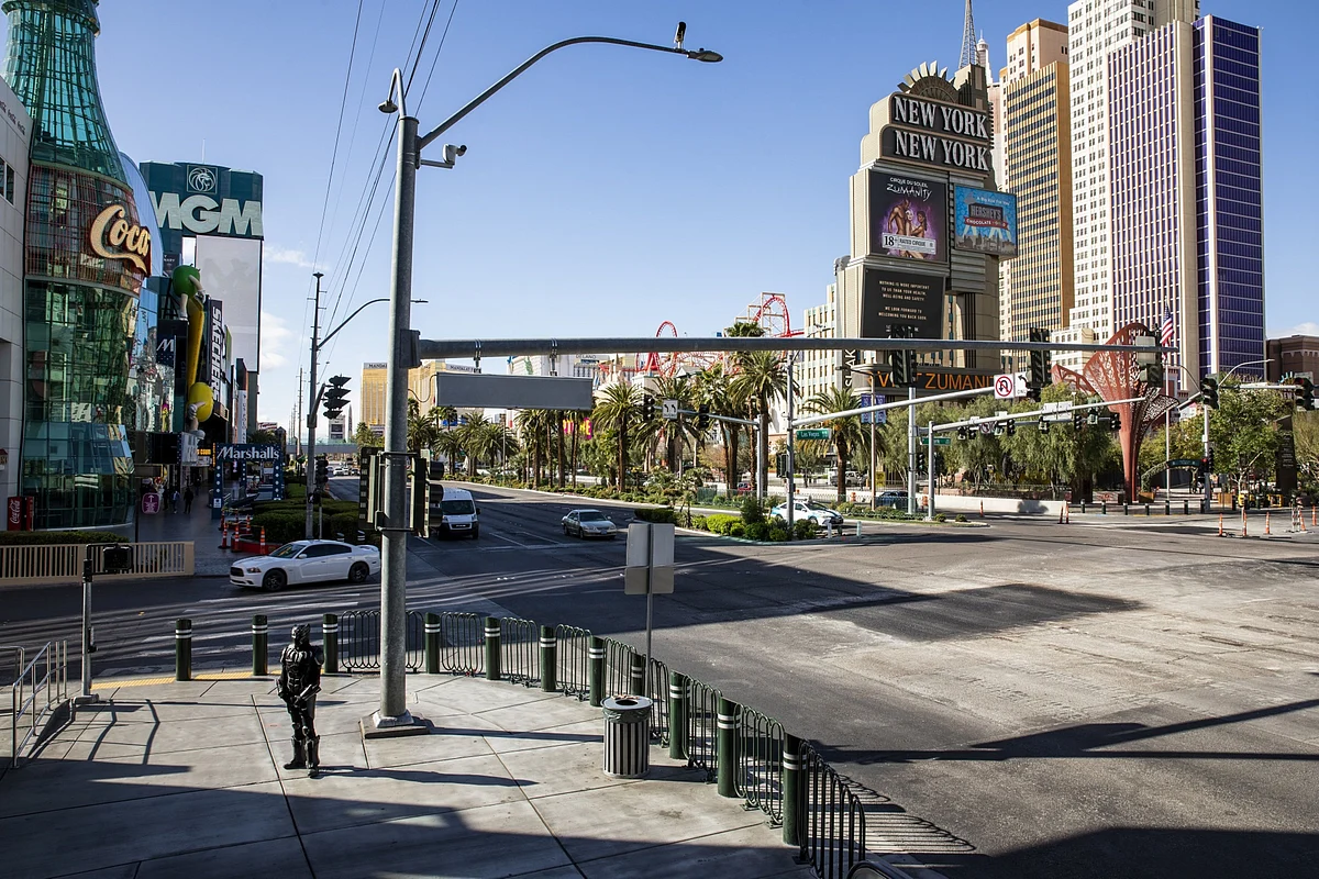 A street performer stands on the Las Vegas Strip in Las Vegas, Nevada, U.S., on Tuesday, March 17, 2020. (Photographer: Joe Buglewicz/Bloomberg)