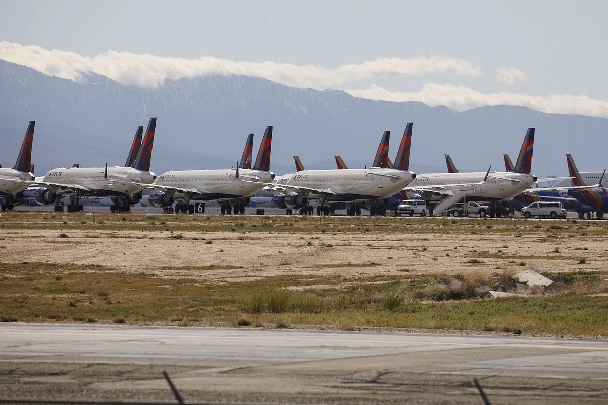 Delta Air Lines aircraft sit parked at a field in California, on March 23, 2020. (Photographer: Patrick T. Fallon/Bloomberg)