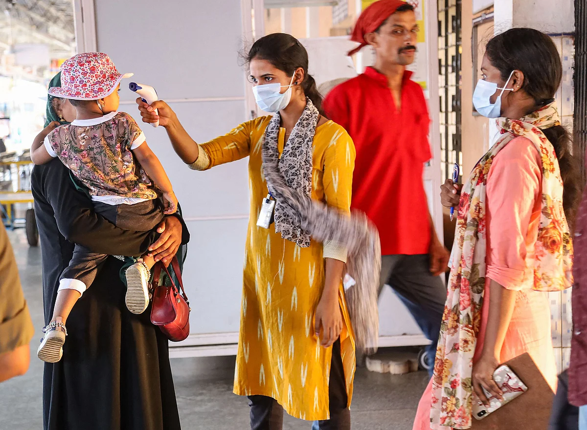 Medics screen passengers at a railway station in Kozhikode, Kerala, on March 16, 2020. (Photograph: PTI)