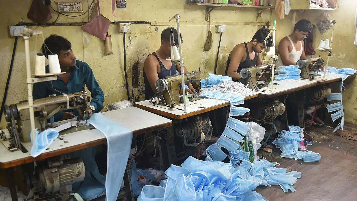 Workers sew masks in the wake of deadly coronavirus, in Mumbai on Tuesday, March 17, 2020. (Photo: PTI)