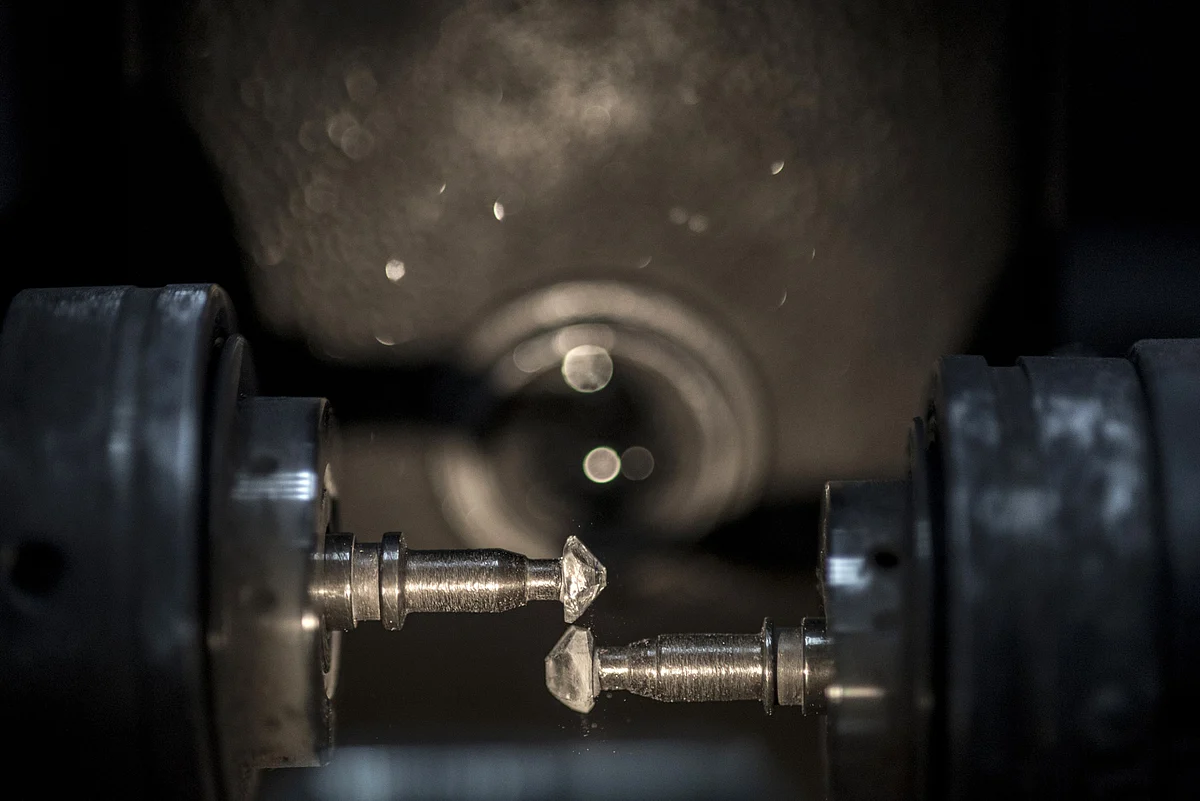 Two diamonds spin in opposite directions to obtain a final round shape during the bruting process in the Modern Manufacturing Center, Tel Aviv, Israel. (Photographer: Geraldine Hope Ghelli/Bloomberg)