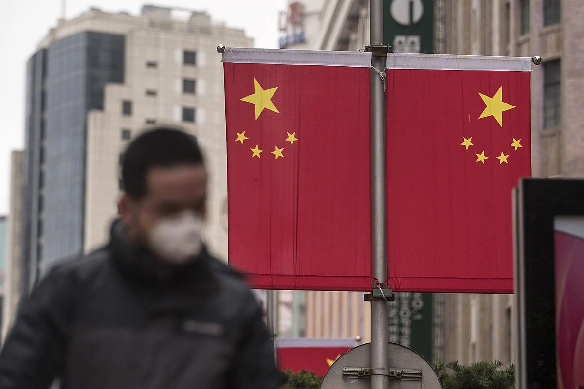 China Boosts Virus Death Tally, Rejects Accusations of Cover Up
