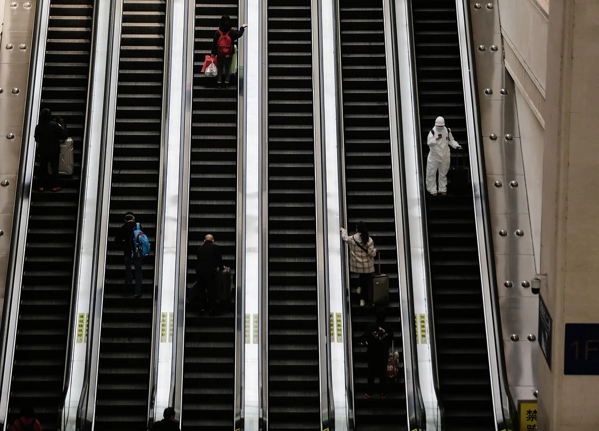 Chaos And Joy At Wuhan Airport As Doctors Take First Flights Out