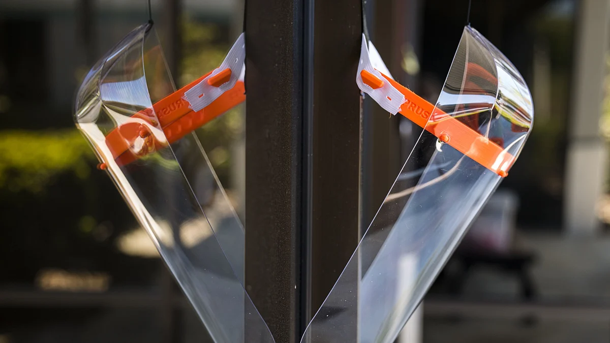 A 3D printed protective face shield hangs in a window at Maker Nexus in Sunnyvale, California, U.S. (Photographer: David Paul Morris/Bloomberg)