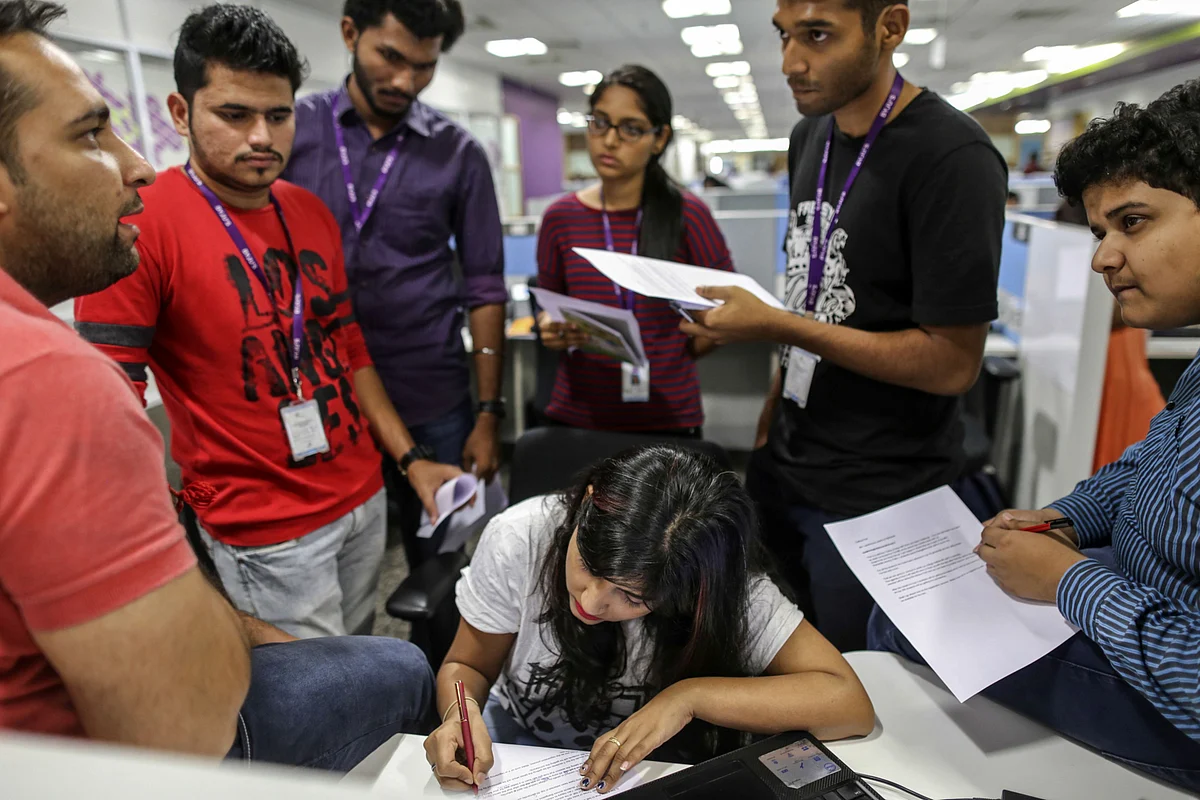 Employees attend a meeting at the Think and Learn Pvt. office in Bengaluru, India before the virus, (Photographer: Dhiraj Singh/Bloomberg)