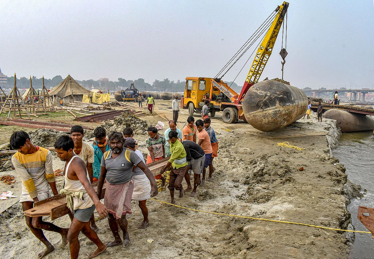 Labourers work to build a floating pontoon bridge in Prayagraj, Uttar Pradesh, on Dec. 2, 2019. (Photograph: PTI)