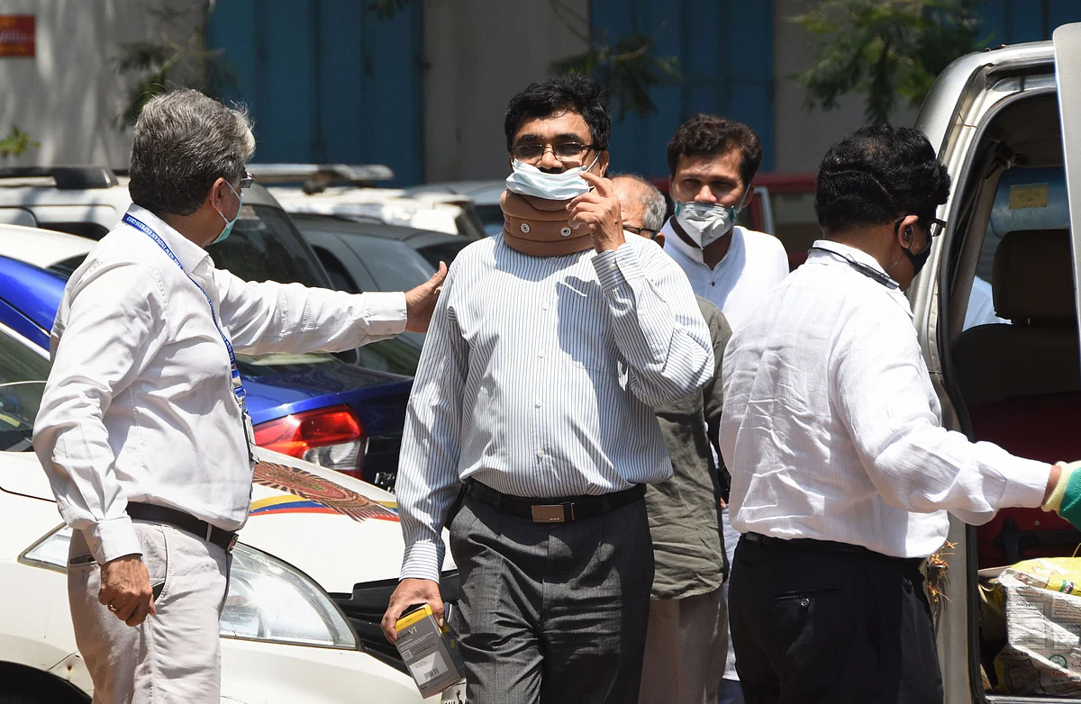Activist and scholar Anand Teltumbde arrives to surrender before the National Investigation Agency, in Mumbai, on April 14, 2020. (Photograph: PTI)