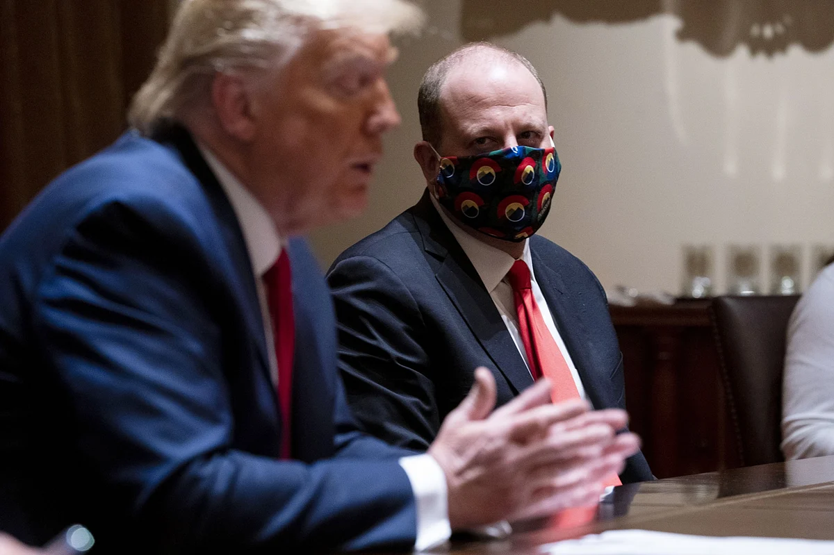 Colorado Governor Jared Polis wears a mask during a meeting with U.S. President Donald Trump in Washington, D.C., on May 13, 2020. (Photographer: Doug Mills/The New York Times/Bloomberg)