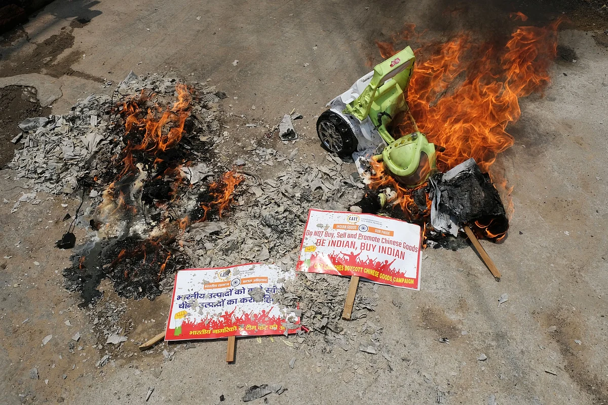 Protesters burn China-made goods at a demonstration in New Delhi, India. (Photographer. T. Narayan/Bloomberg)
