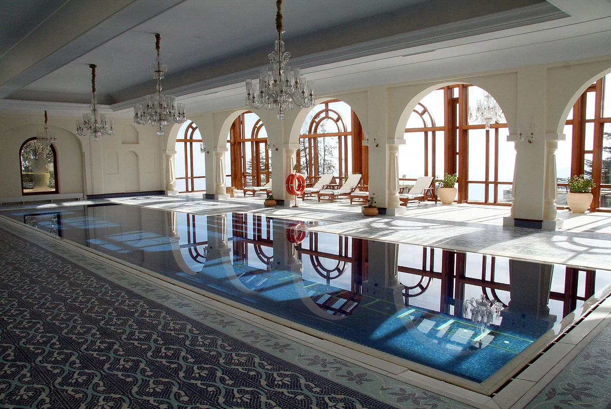 The indoor swimming pool is pictured at Oberoi Hotels & Resorts Co.’s Wildflower Hall in Shimla. (Photographer: Adam Majendie/Bloomberg News)