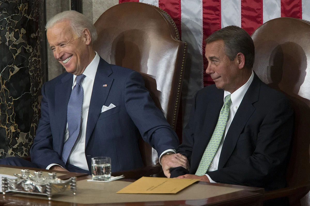 Vice President Joe Biden, a Democrat, with U.S. House Speaker John Boehner, a Republican, at the Capitol in Washington, D.C. on Jan. 28, 2014. (Photographer: Andrew Harrer/Bloomberg)