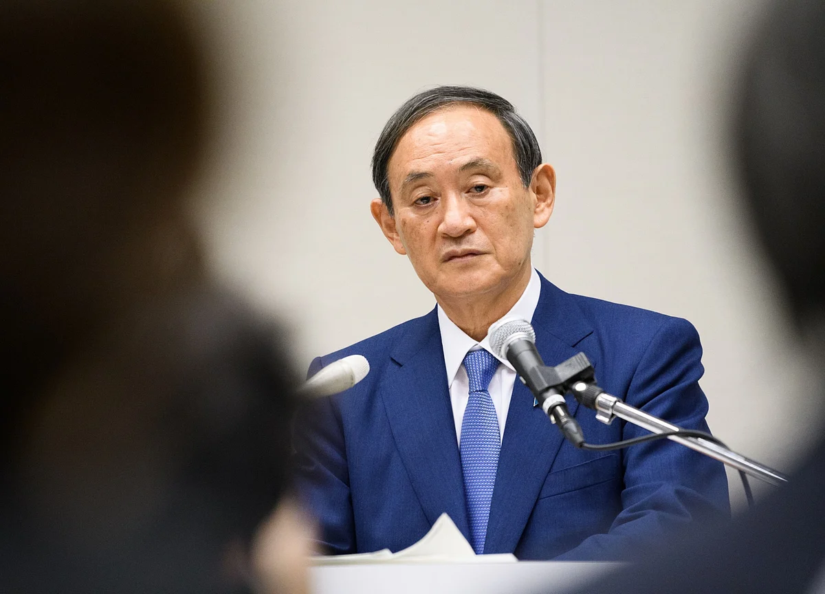 Suga Tightens Grip on Japan Premier Job, Vows to Keep Abenomics