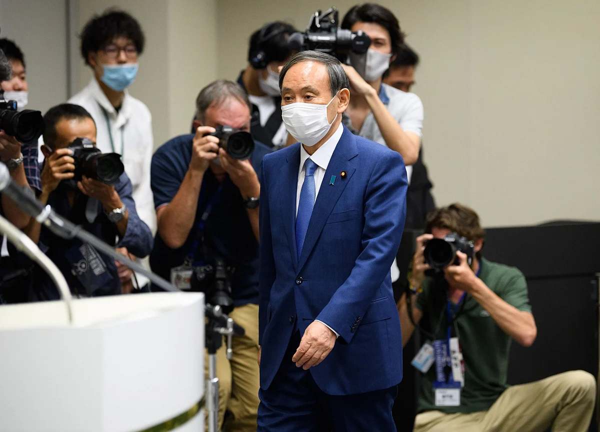 Japan’s Ultimate Insider Faces Test Navigating U.S.-China Feud