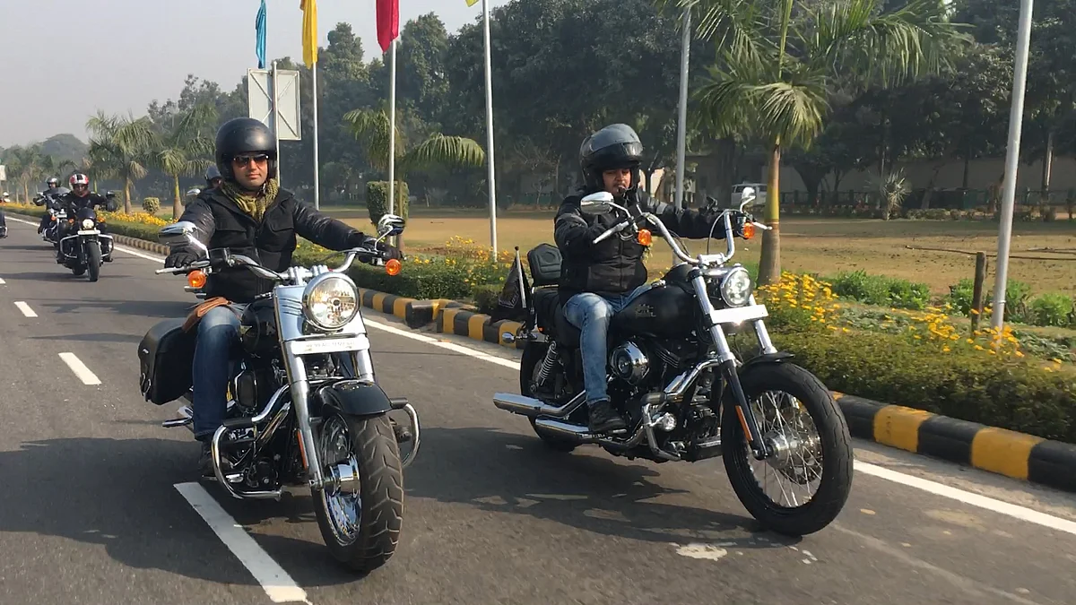 Members of Harley Davidson Owners Group riding a Fat Boy and Heritage Softail Classic in Delhi. 
