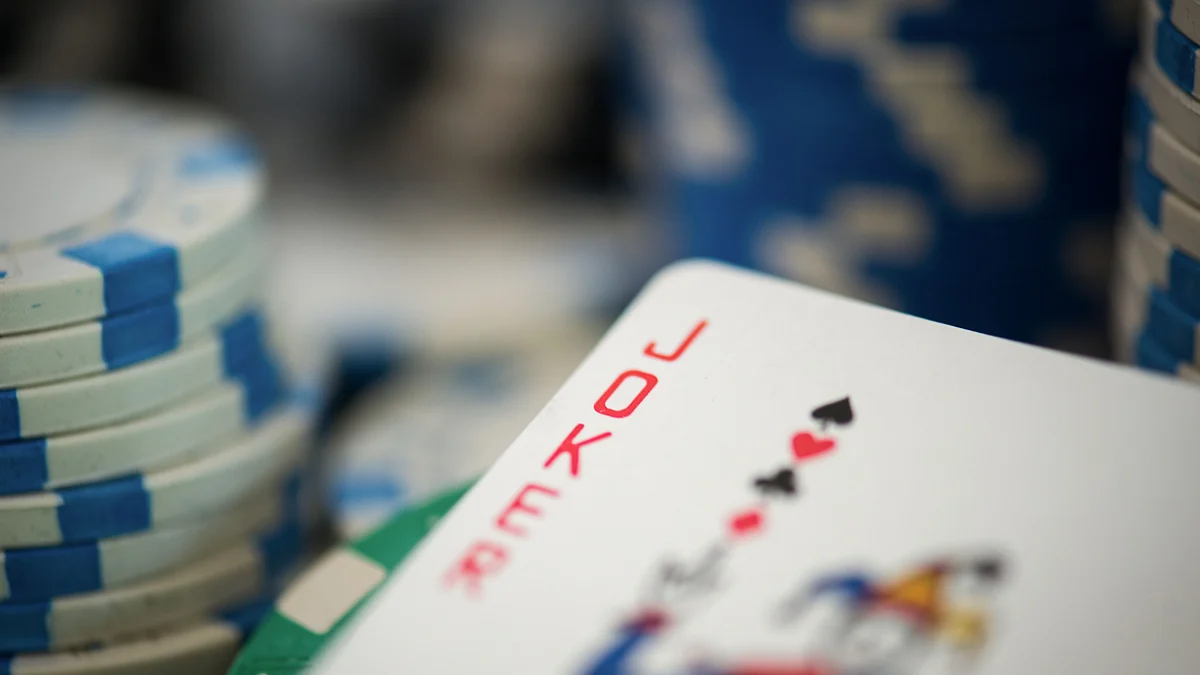 A Joker card and poker chips are arranged for a photograph. (Photographer: Ron Antonelli/Bloomberg)
