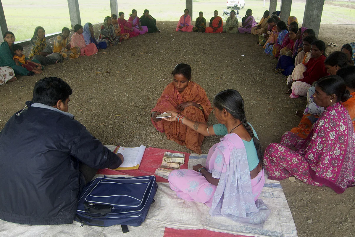 A woman receives a micro-loan in Sadashivpet, Telangana. (Photographer: Adeel Halim/Bloomberg)