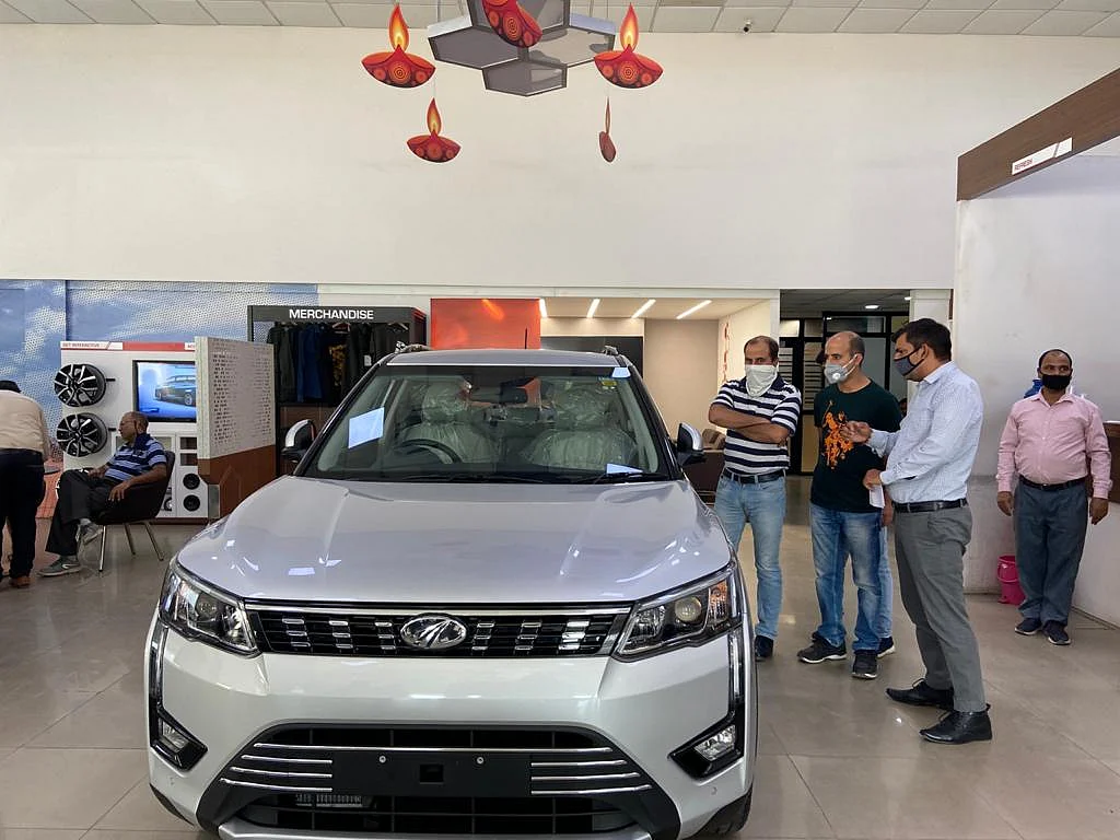 Consumers at a Mahindra dealership in Delhi-NCR. (Photographer: Nishant Sharma/BloombergQuint)