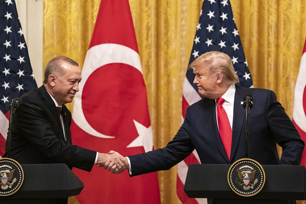 U.S. President Donald Trump shakes hands with his Turkish counterpart Recep Tayyip Erdogan at the White House in Washington, D.C., on Nov. 13, 2019. (Photographer: Alex Edelman/Bloomberg)