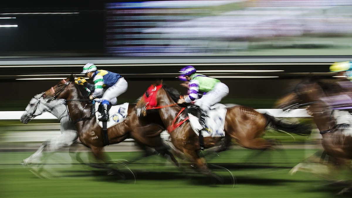 <div class="paragraphs"><p>Horses gallop at a racecourse. (Photographer: Justin Chin/Bloomberg)</p></div>