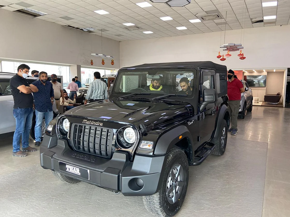 Consumers at a Mahindra dealership checking the newly launched That in Delhi-NCR. (Photographer: Nishant Sharma/BloombergQuint)