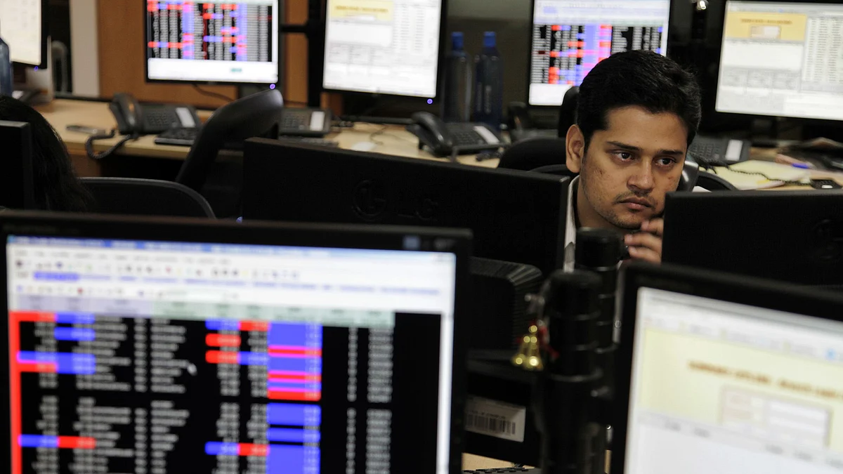 A stock broker trades in Mumbai. (Photographer: Kuni Takahashi/Bloomberg)