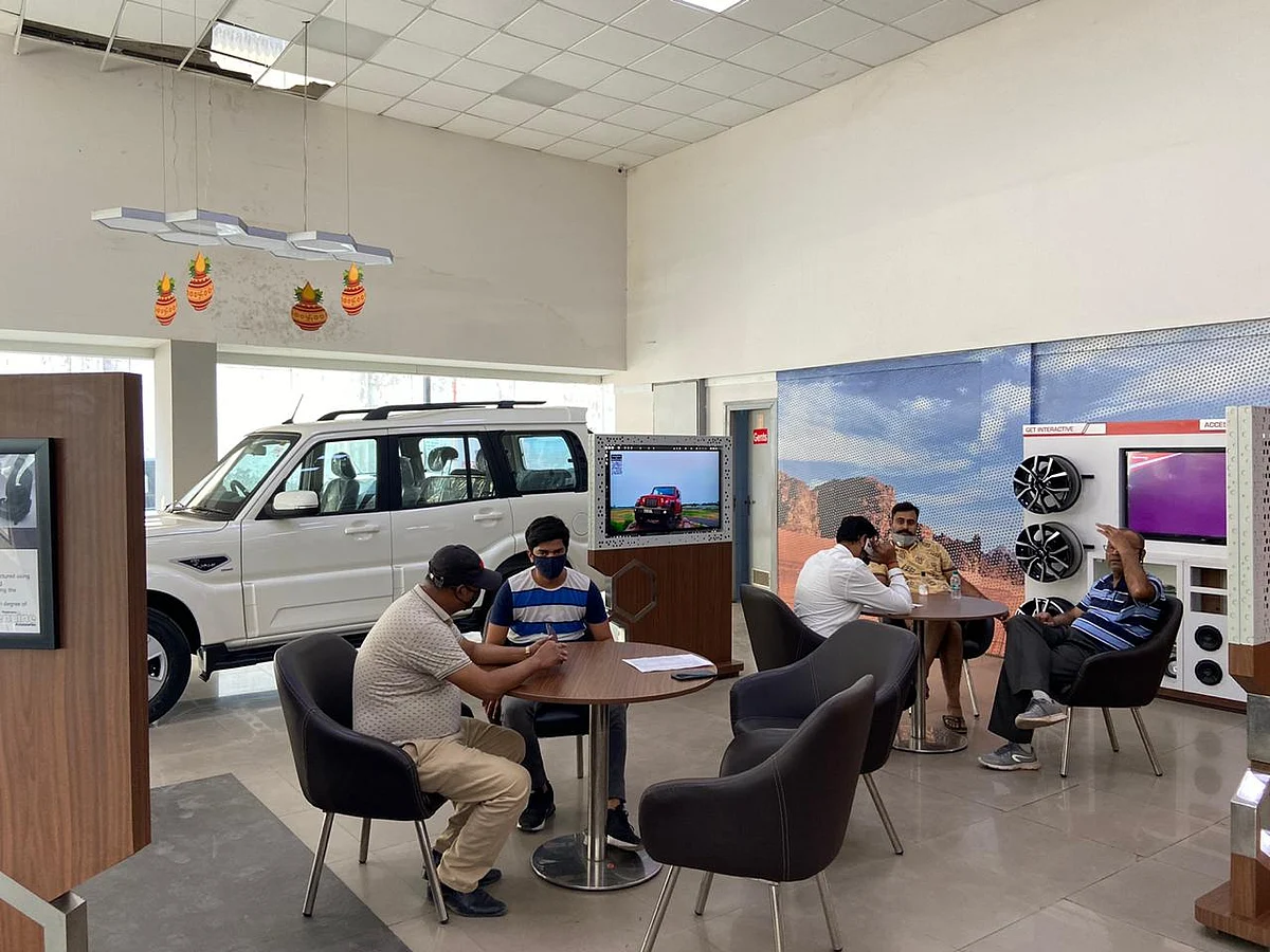 Consumers at a Mahindra dealership in Delhi-NCR. (Photographer: Nishant Sharma/BloombergQuint)