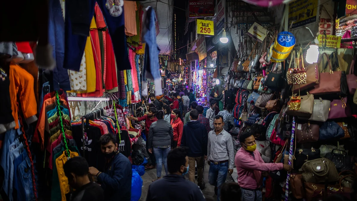 Customers shop during the festival of Dhanteras at night in Atta Market in Noida, Uttar Pradesh, India, on Friday, Nov.13, 2020. Photographer: Prashanth Vishwanthan/Bloomberg