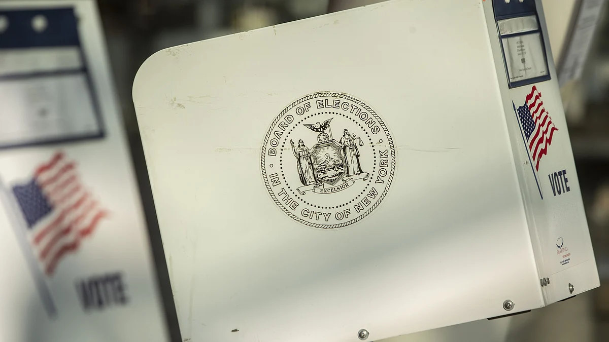 “Board Of Elections Of The City Of New York” is displayed on the side of an empty voting booth at a polling location in Brooklyn. (Photographer: Victor Blue/Bloomberg)
