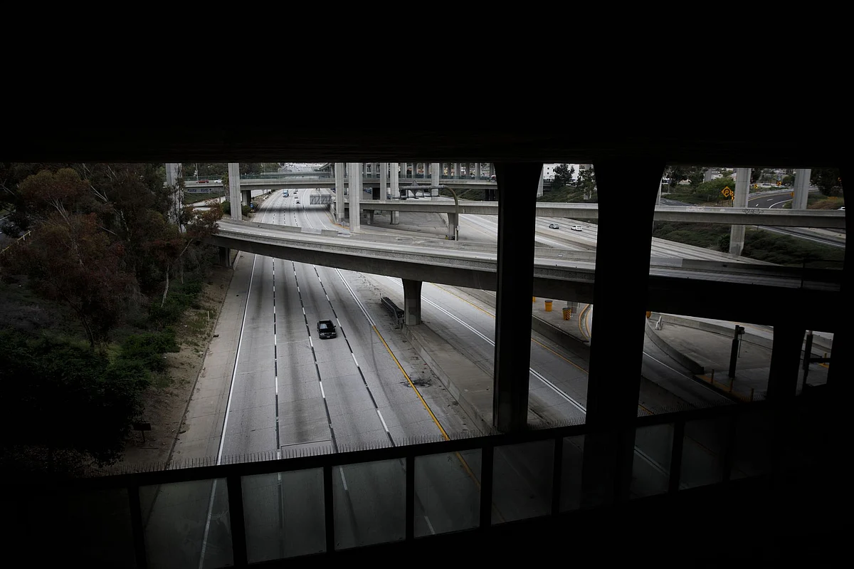 A lone driver is seen along the usually jammed 110 freeway in Los Angeles on April 20. Greenhouse gas emissions slowed noticeably as a result of lockdowns this year. Photographer: Patrick T. Fallon/Bloomberg