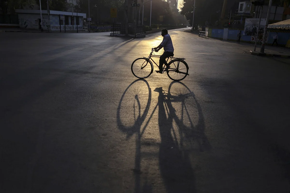 A cyclist rides through the Churchgate area during a lockdown in Mumbai, India, on April 5. Photographer: Dhiraj Singh/Bloomberg 
