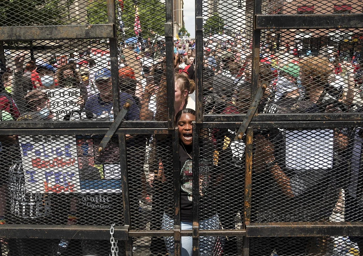 U.S. President Donald Trump was confronted by a national upheaval over American police killings of unarmed Black citizens. In Tulsa, Oklahoma, demonstrators rallied at an entrance gate to one of his campaign events on June 20. Photographer: Matthew Hatcher/Bloomberg 