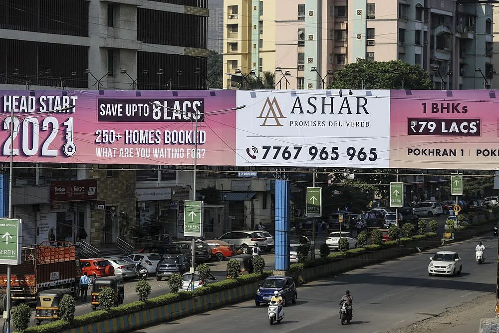 An advertisment for real estate develop Ashar Group in Thane on the outskirts of Mumbai. (Photographer: Dhiraj Singh/Bloomberg)