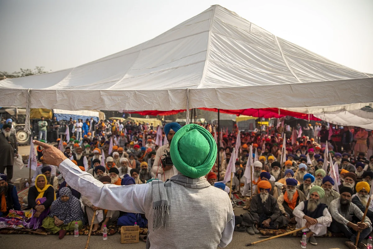 Farmers gather for a speech at a protest site at a road block on the Delhi-Haryana border crossing in Singhu, Delhi, India, on Thursday, Dec. 3, 2020. (Photographer: Prashanth Vishwanathan/Bloomberg)
