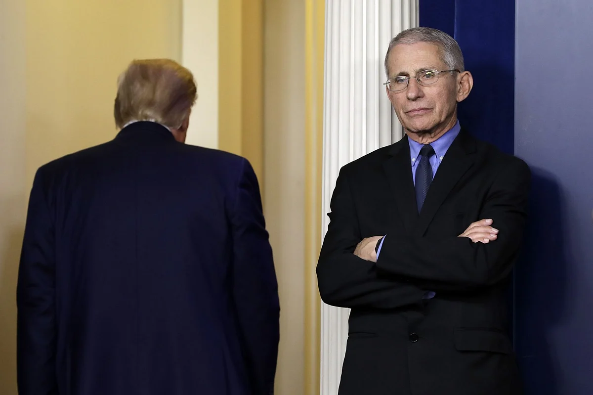 Anthony Fauci, the U.S. government’s top infectious-disease expert, looks on as President Donald Trump exits a news conference in Washington on March 26. Photographer: Yuri Gripas/Abaca Press/Bloomberg 