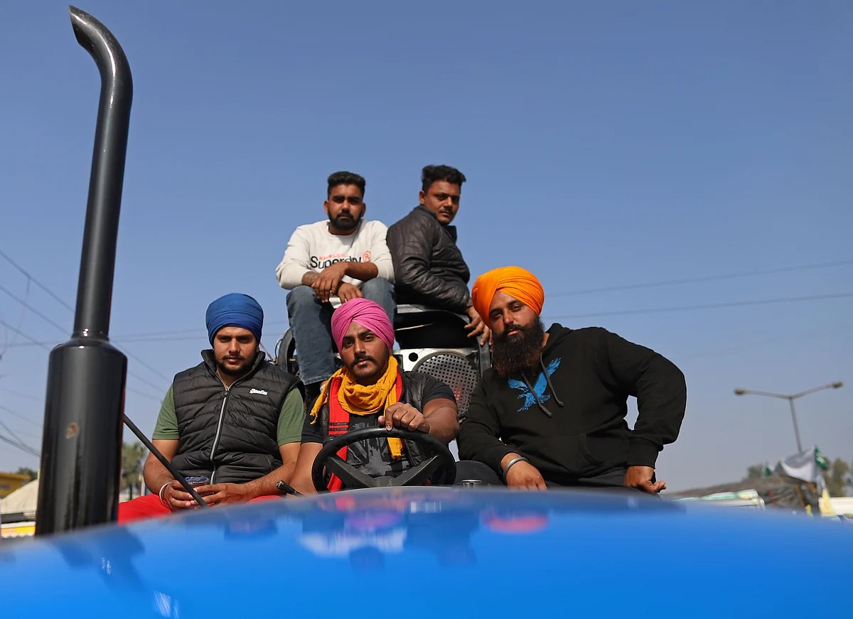 Farmers gather at a protest site at a road block on the Delhi-Haryana border crossing in Singhu, Delhi, India (Photographer: Prashanth Vishwanathan/Bloomberg)