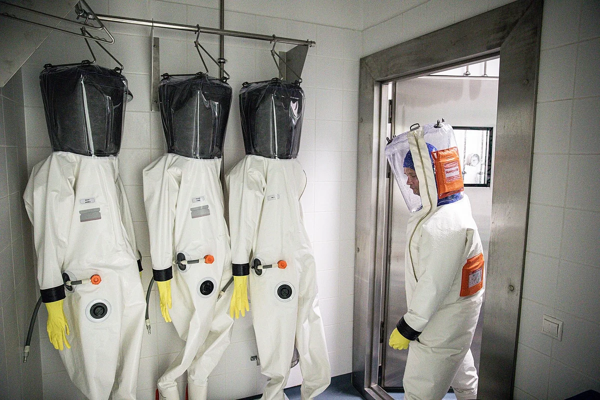 A scientist enters a decontamination chamber at a coronavirus research laboratory in Pecs, Hungary, on April 27. Photographer: Akos Stiller/Bloomberg