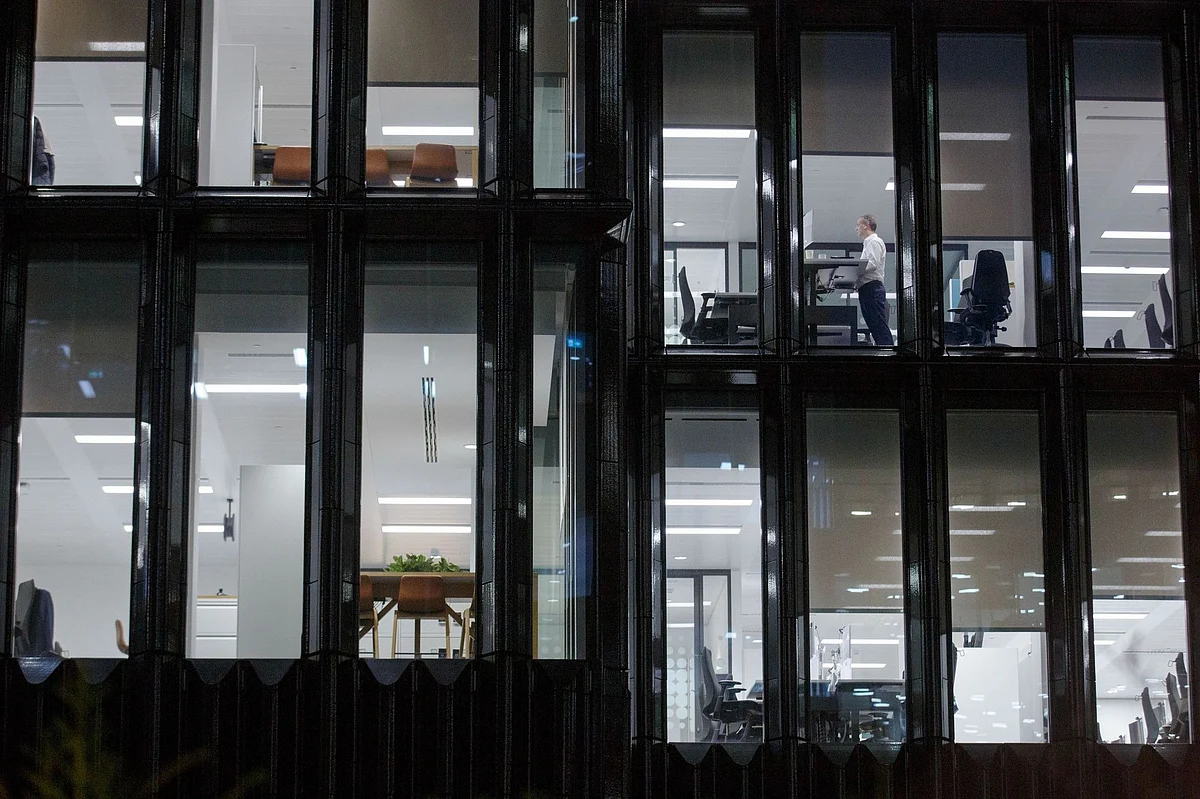 As financial-services companies sent employees to work from home, a lone office worker in London remained at his post on March 16. Photographer: Luke MacGregor/Bloomberg 