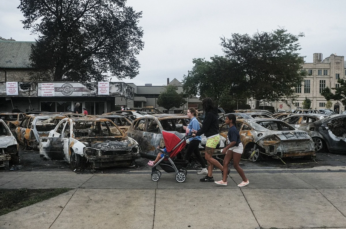 A burned out auto dealership in Kenosha, Wisconsin, on Sept. 1, a week after a White police officer, Rusten Sheskey, shot Jacob Blake, an unarmed Black man, several times in the back, paralyzing him. Photographer: Matthew Hatcher/Bloomberg 