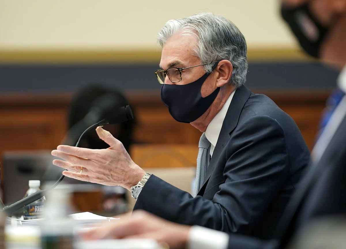 Powell Signals Fed to Keep Buying Bonds Even as Outlook Improves