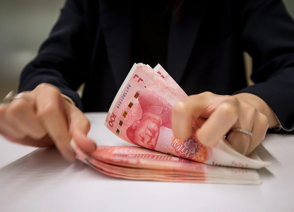 China Acts to Slow Gains by Strongest Yuan in Almost Three Years