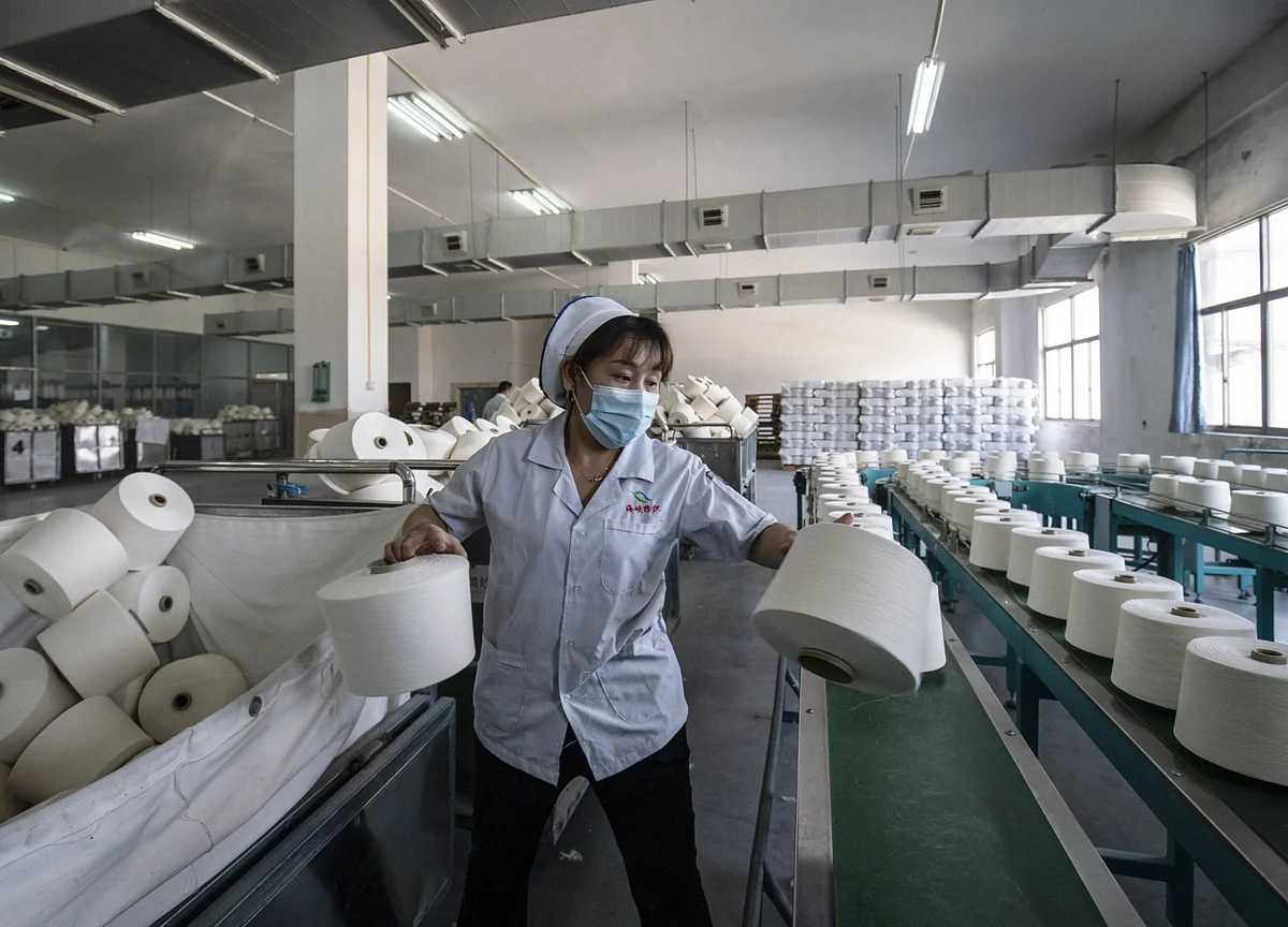 Covid Keeps Workers in Factories, Distorting China Spending