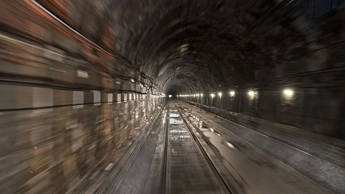 Train tracks run through a section of of a tunnel. (Photographer: Andrew Harrer/Bloomberg)
