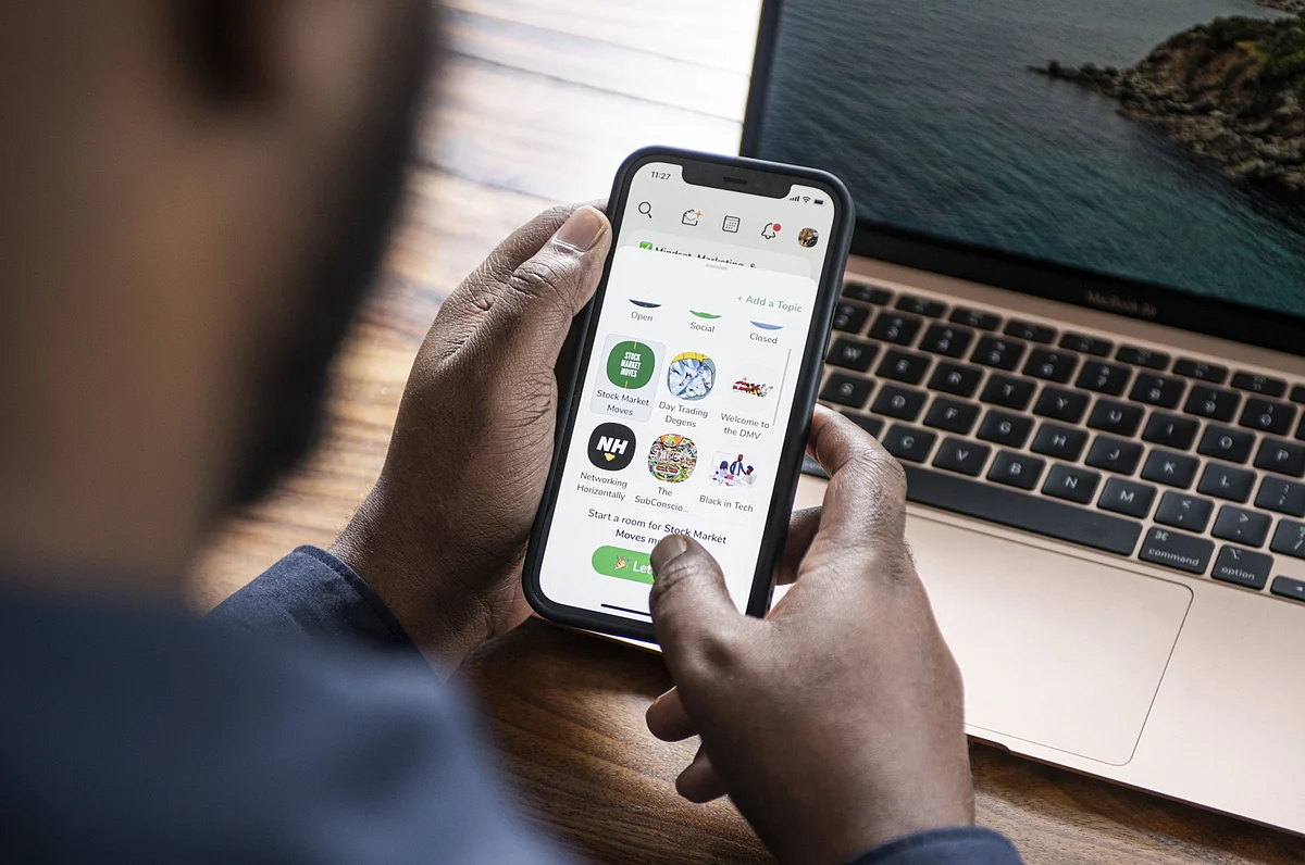 Dion Foxworth, co-host of the “Stock Market Moves” show, uses the Clubhouse app, in Johannesburg, on Feb. 12 2021. (Photographer: Waldo Swiegers/Bloomberg)