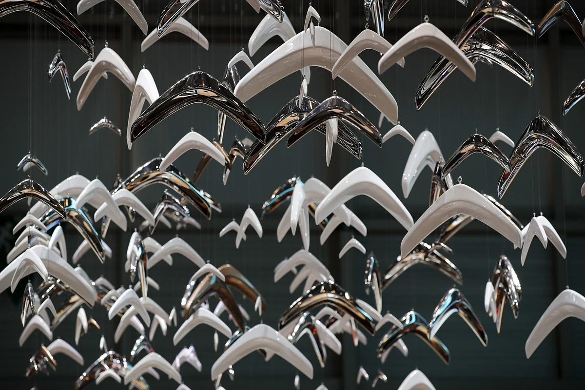 Citroen logos hang at the company's exhibition space. Photographer: StefanWermuth/Bloomberg
