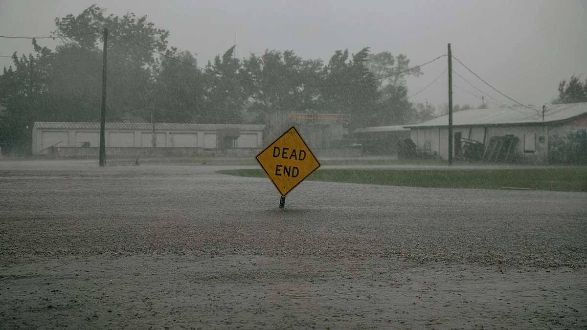 A traffic sign submerged in floodwater. (Photographer: Bryan Tarnowski/Bloomberg)