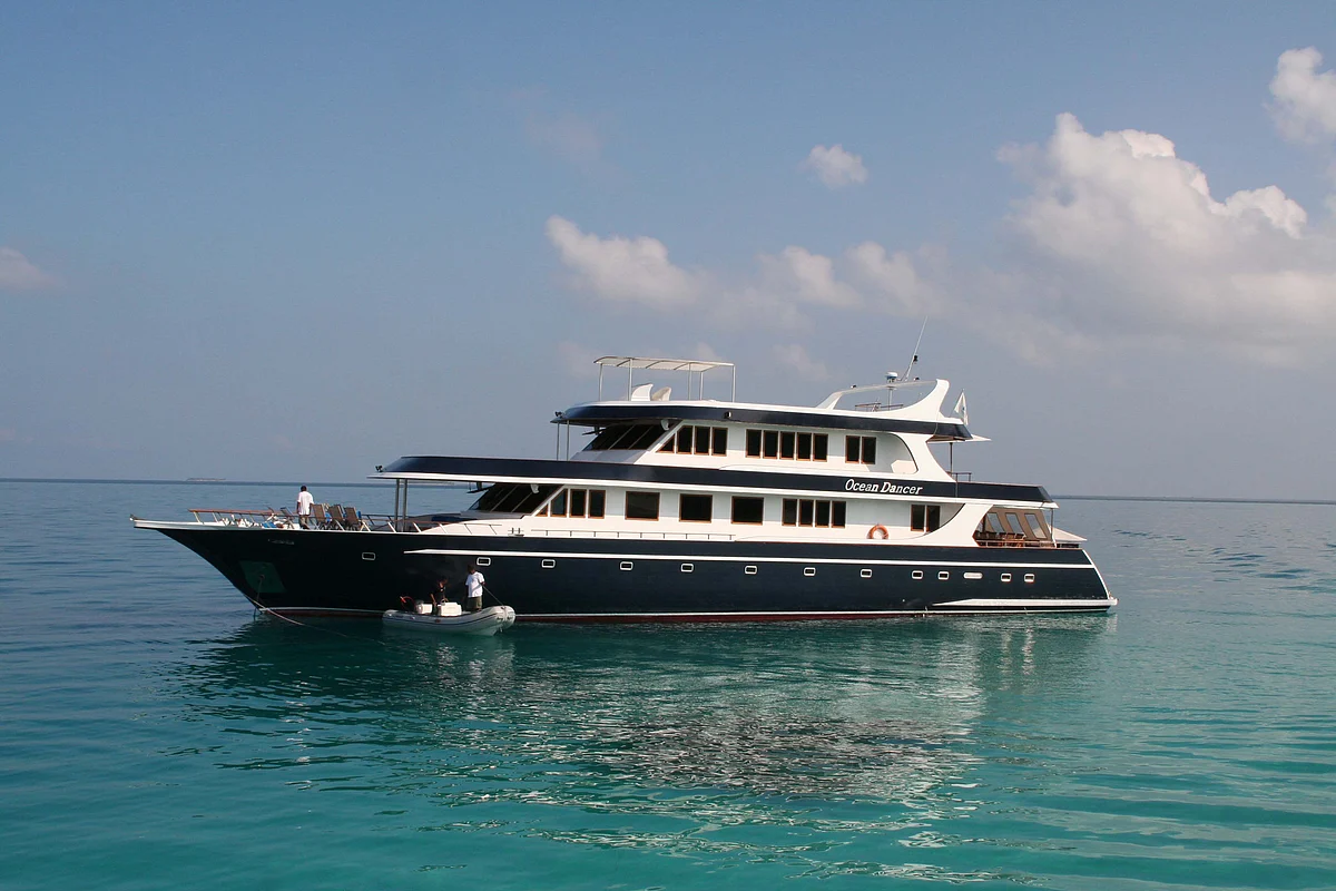 The 110-foot luxury motor yacht Ocean Dancer from Peter Hughes Diving sits anchored in the Maldives. (Photographer: Nadja Brandt/Bloomberg News)