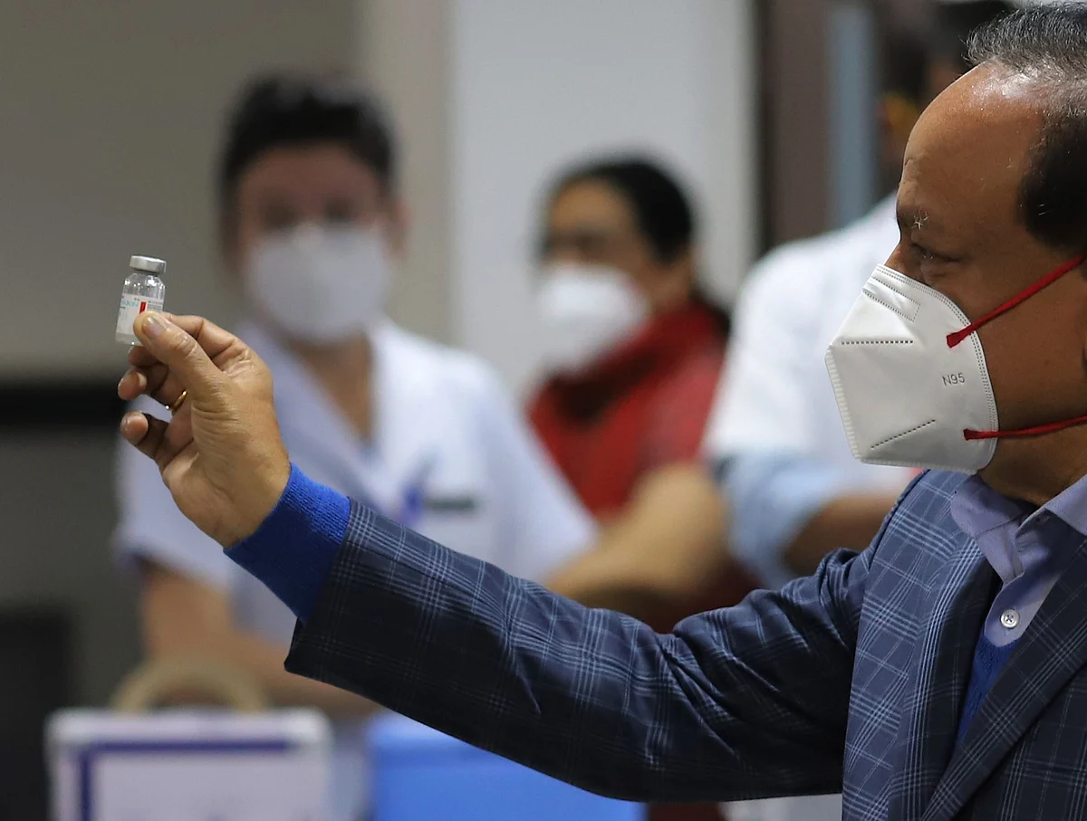 Harsh Vardhan, India's health minister, displays a vial of Covaxin, at
AIIMS in New Delhi, on Jan. 16, 2021. (Photographer: Anindito Mukherjee/Bloomberg)