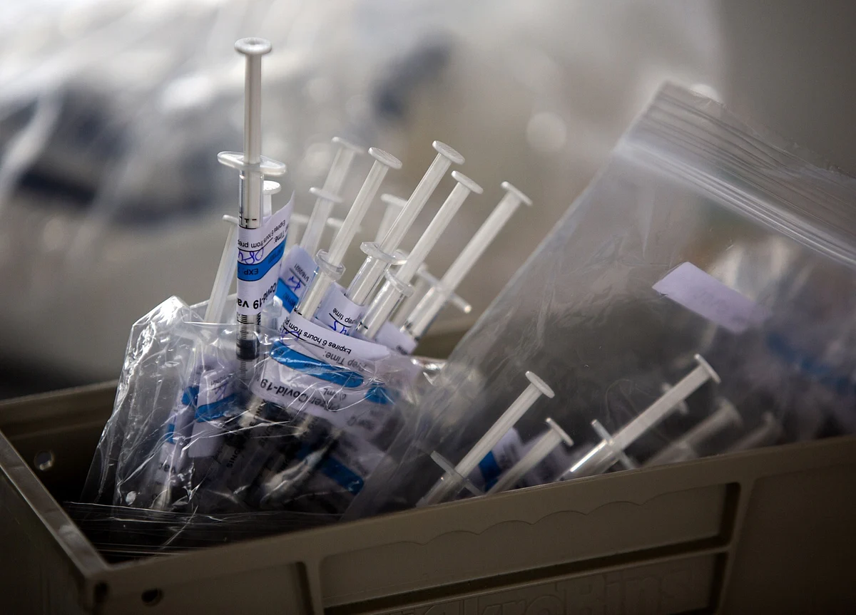 No Masks for Vaccinated Amazon Staff; Paris Cafes: Virus Update